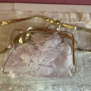 Transparent Clear Gold-Trimmed Concert Bag. Adjustable strap.  Like new.